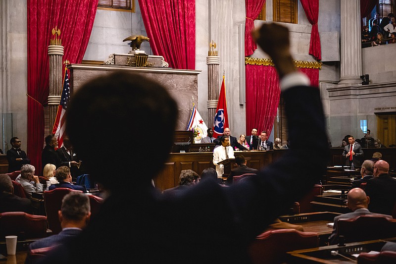 State Rep. Justin Pearson raises his fists as State Rep. Justin Jones speaks  on the floor of the House chamber at the State Capitol in Nashville, Tenn., April 6, 2023. The Tennessee House voted on Thursday to expel two Democrats from the state legislature one week after they interrupted debate by leading protesters in a call for stricter gun laws after a shooting that left six dead at a Christian school. (Jon Cherry/The New York Times)