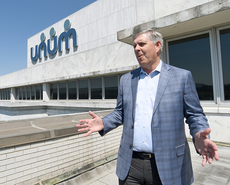 Staff Photo by Matt Hamilton / Unum CEO Rick McKenney talks about the view from the roof at the insurer's Chattanooga headquarters Wednesday.