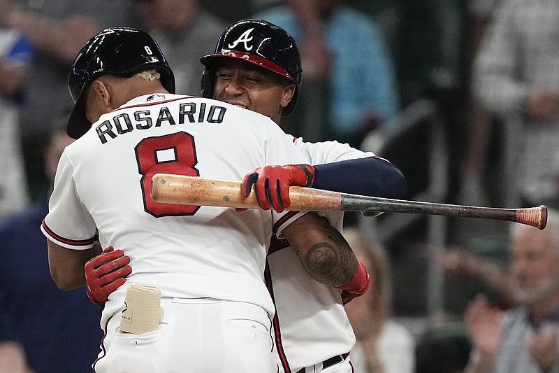 Atlanta Braves' Eddie Rosario runs the bases after hitting a home