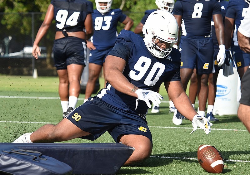 Staff photo by Matt Hamilton / Defensive lineman Devonnsha Maxwell dives on the ball as part of a fumble drill during a UTC practice last August at Scrappy Moore Field. After putting together one of the best careers in Mocs football history, Maxwell hopes to be in an NFL training camp later this year, possibly as a draft pick.