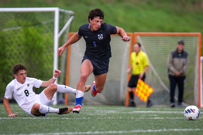 Staff photo by Olivia Ross / Boyd Buchanan senior soccer standout Mills Wood (1) heads for the ball during Friday's home game against Notre Dame.