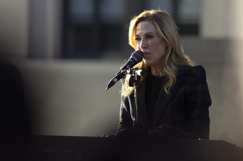 Singer Sheryl Crow performs during a vigil held for victims of The Covenant School school shooting on Wednesday, March 29, 2023, in Nashville, Tenn. (AP Photo/Wade Payne)