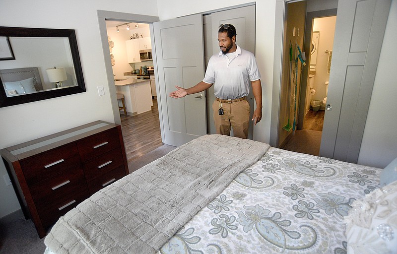 Staff photo by Matt Hamilton / Kendall Petersen talks about the bedroom at a vacation rental property on Riverfront Parkway on March 6.