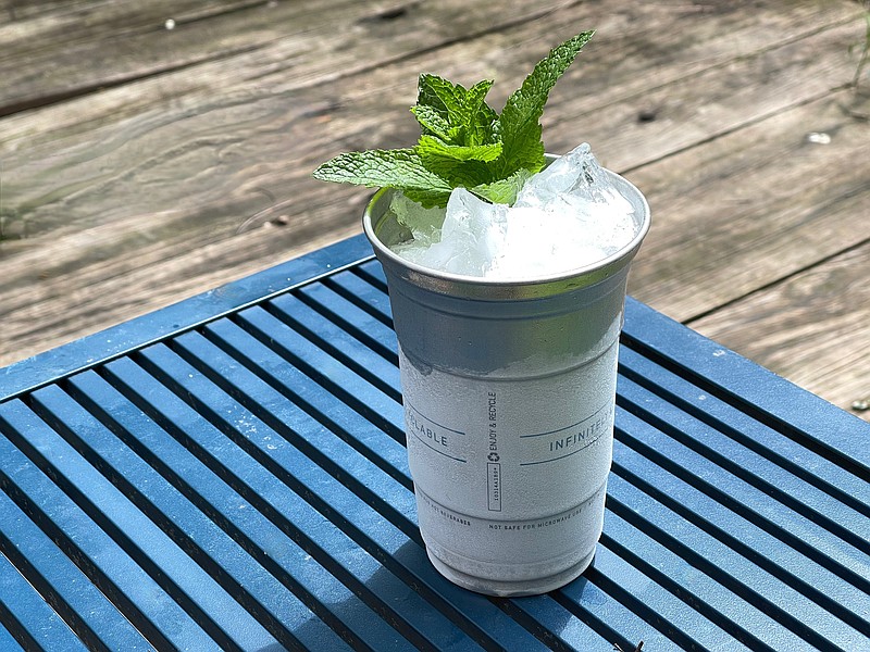 Swap Kentucky bourbon for white wine to give a traditional mint julep a refreshing makeover. / Arkansas Democrat-Gazette photo illustration/Kelly Brant