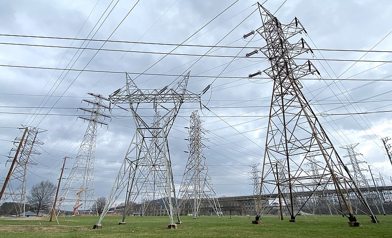 Staff Photo by Robin Rudd / The Tennessee Valley Authority's Chickamauga Dam is seen behind transmission towers Feb. 16.