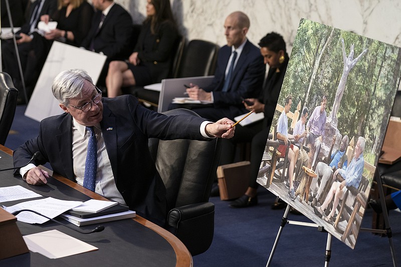 Photo/Sarah Silbiger/The New York Times / Sen. Sheldon Whitehouse, D-R.I., displays a photo of Justice Clarence Thomas during a Senate Judiciary Committee hearing on Supreme Court ethics reform on Capitol Hill in Washington on May 2, 2023.