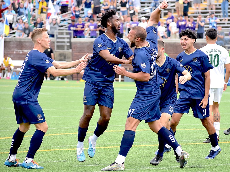 Staff photo by Patrick MacCoon / Chattanooga FC's Anatolie Prepelita swings his arm in the air in celebration of his tying goal during stoppage time near the end of Saturday's 1-1 draw against the Savannah Clovers at Finley Stadium.