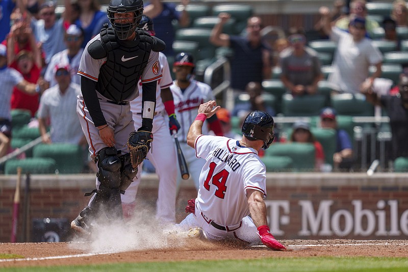 AP photo by Erik Rank / Sam Hilliard slides into home plate on a wild pitch by Baltimore Orioles reliever Félix Bautista in the bottom of the 10th inning Sunday. Hilliard's run made it 2-all, and the Braves earned a walk-off win in the 12th when Michael Harris II doubled to the wall to drive in Ozzie Albies.