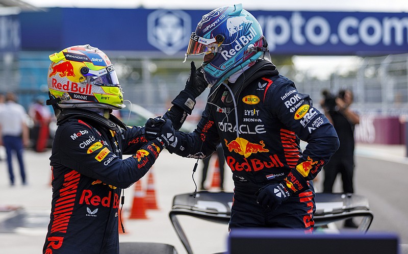 Miami Herald photo by Matias J. Ocner via AP / Miami Grand Prix winner Max Verstappen, right, celebrates with Red Bull teammate Sergio Perez after Sunday's Formula One race in Miami Gardens, Fla.