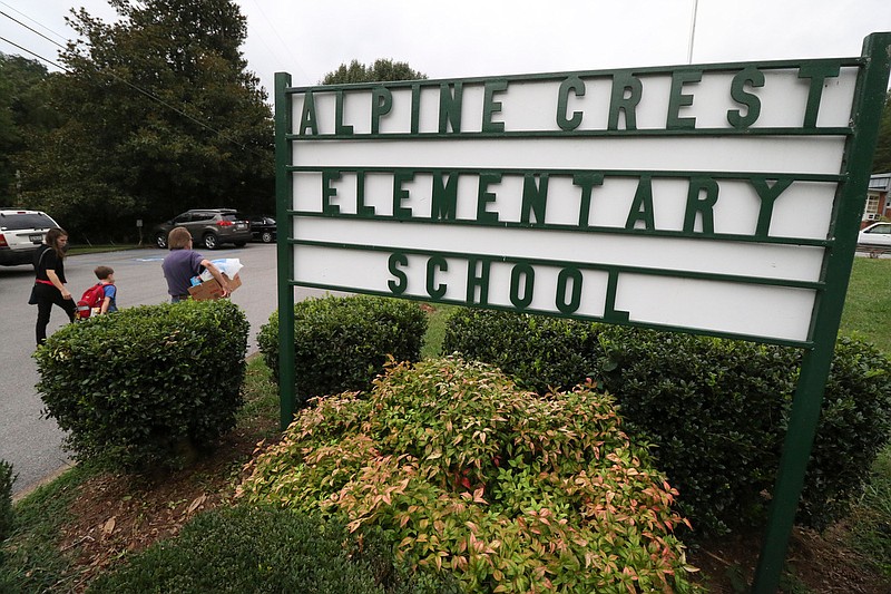 Staff Photo File Photo / The entry sign at Alpine Crest Elementary is shown Aug. 11, 2016.