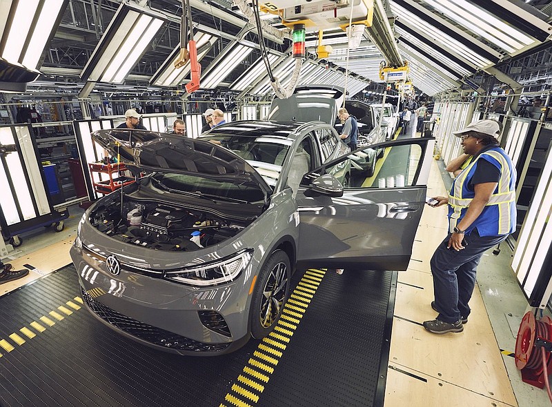 Contributed photo by Volkswagen / Volkswagen Chattanooga employees work in 2022 on an ID.4 electric SUV as production was officially launched on the vehicle last fall.