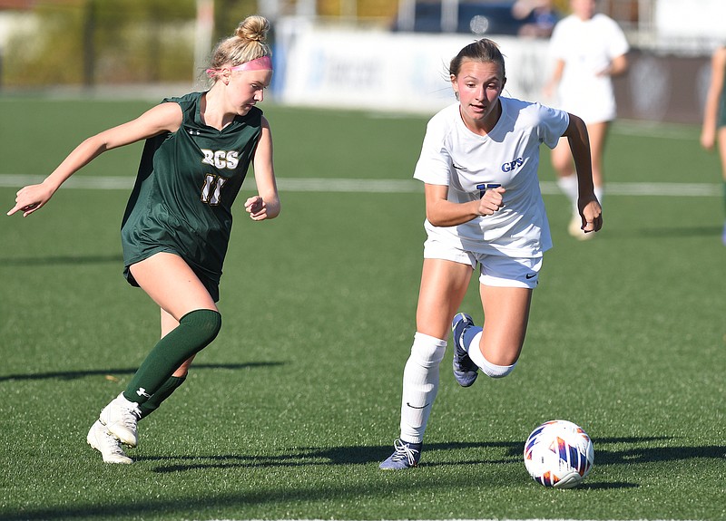 Staff photo by Matt Hamilton / GPS forward Sasha Carbone, right, and Briarcrest Christian's Sophie Ham battle for the soccer ball during the TSSAA Division II-AA state final on Oct. 28 at CHI Memorial Stadium in East Ridge. Carbone scored three goals that day, with her hat trick leading the Bruisers to a 4-1 victory.