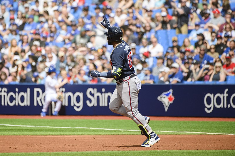 The Canadian Press photo by Christopher Katsarov via AP / Atlanta Braves designated hitter Marcell Ozuna rounds the bases after hitting a two-run homer in the second inning of Saturday's game against the host Toronto Blue Jays.