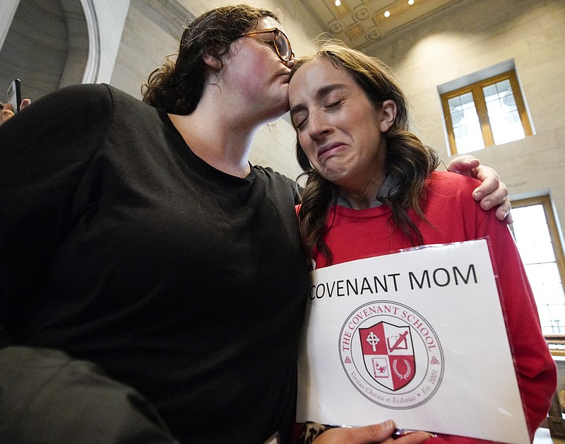 Ashley Cates comforts Sarah Neumann as she gets emotional talking about the Covenant School Shooting outside the House chamber Thursday, April 6, 2023, in Nashville, Tenn. Tennessee Republicans are seeking to oust three House Democrats for using a bullhorn to shout support for pro-gun control protesters in the House chamber. (AP Photo/George Walker IV)
