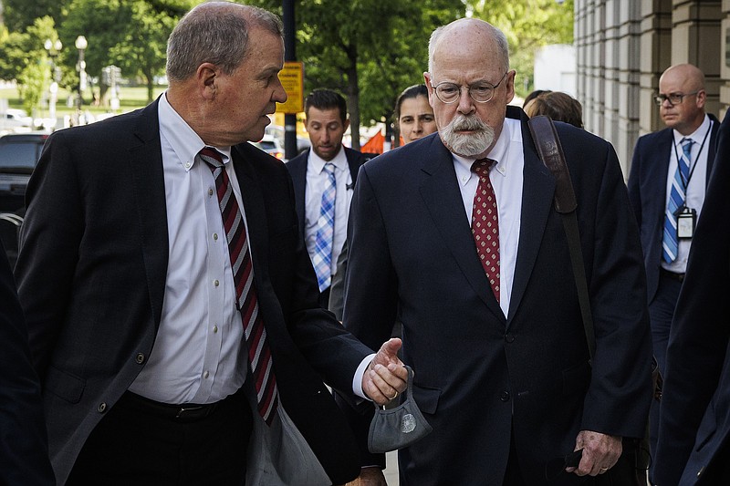 File photo/Samuel Corum/The New York Times / Special counsel John Durham walks out of the William B. Bryant Federal Courthouse in Washington on May 17, 2022. A report by Durham on the origins of the FBIs investigation into the Trump campaigns work with Russia produced no startling revelations.