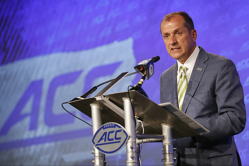 AP photo by Nell Redmond / ACC commissioner Jim Phillips speaks during the conference's football media days event last July in Charlotte, N.C.