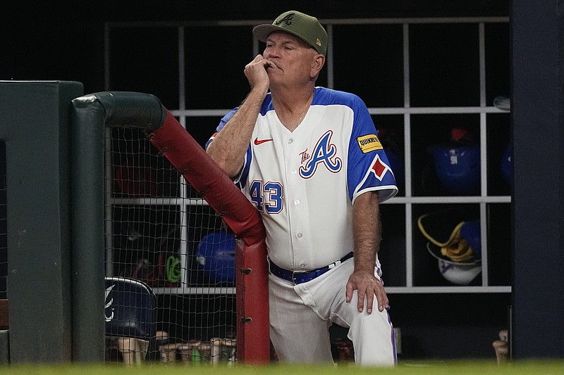 AP photo by John Bazemore / Atlanta Braves manager Brian Snitker watches from the dugout during Saturday night's home game against the Seattle Mariners.