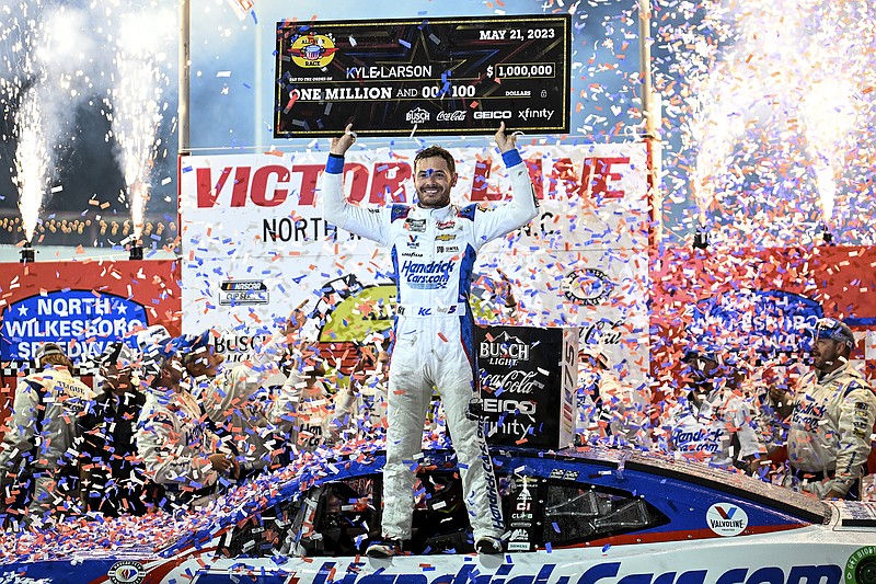 AP photo by Matt Kelley / Hendrick Motorsports driver Kyle Larson celebrates in victory lane at North Carolina's North Wilkesboro Speedway after winning the NASCAR All-Star Race on Sunday night.