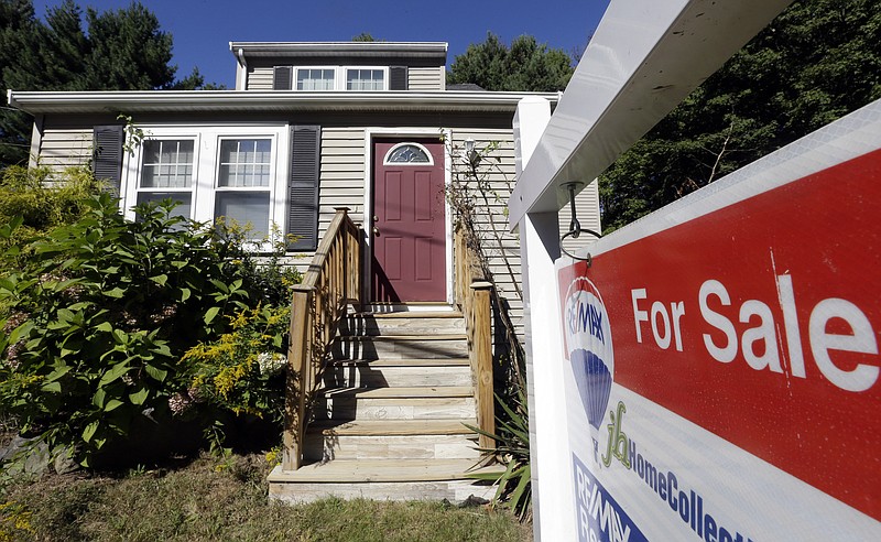 FILE - In this Wednesday, Sept. 18, 2013, file photo, a "For Sale" sign hangs in front of a house in Walpole, Mass. A new study of all 212 major U.S. cities finds most of the hottest markets are in the Southeast. (AP Photo/Steven Senne, File)