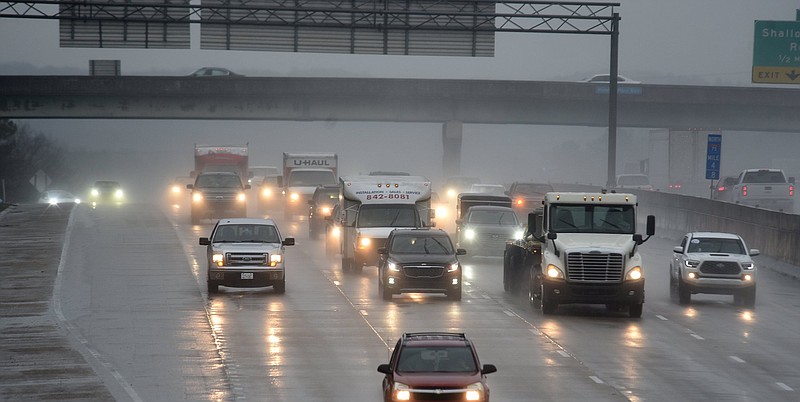 Staff file photo/Matt Hamilton / Traffic moves through the rain on I-75 near the Hamilton Place Mall on Thursday, Feb. 2, 2023.