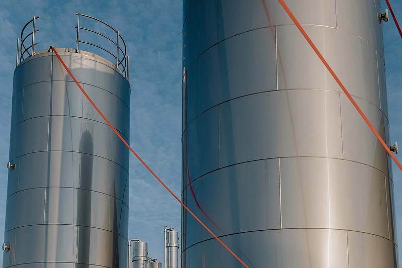 Storage tanks for substances like animal fat at Bio Energy Coevorden, a biogas plant acquired by Varo Energy, in Coevorden, Netherlands, April 4, 2023. Varo Energy, a Swiss provider of gasoline and diesel, is charting a path to lower carbon energy by relying on farm waste and used cooking oil. (Ilvy Njiokiktjien/The New York Times)