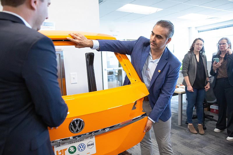 Contributed Photo / Pablo Di Si, president of Volkswagen Group of America, looks over a vehicle at Volkswagens Innovation Hub at the Cherokee Farm in Knoxville. VW is conducting research and developing more engineering talent in a joint venture with the University of Tennessee in Knoxville and the Oak Ridge National Laboratory.