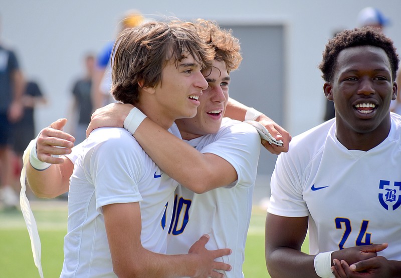 Staff photo by Patrick MacCoon / Boyd Buchanan's Andrew Pollard, left, celebrates with teammates after the Buccaneers' 1-0 victory over Bell Buckle's Webb School in Wednesday's TSSAA Division II-A state semifinals at the Richard Siegel Soccer Complex in Murfreesboro, Tenn. Pollard scored in the 62nd minute.