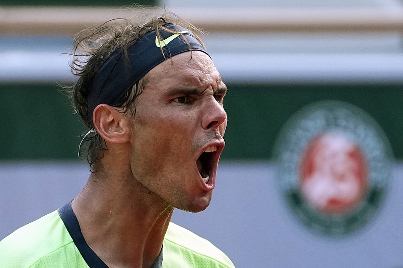 AP photo by Michel Euler / Rafael Nadal shouts as he plays Diego Schwartzman during a French Open quarterfinal in June 2021. The 2023 edition of the clay court Grand Slam tournament begins Sunday in Paris, but 14-time champion Nadal announced last week that he would not compete due to injury.