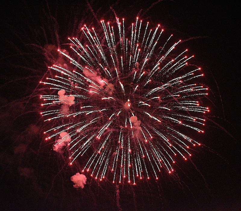 Staff Photo by Matt Hamilton / A firework explodes in the sky at Heritage Point Park in Dalton, Ga., on July 4, 2021.