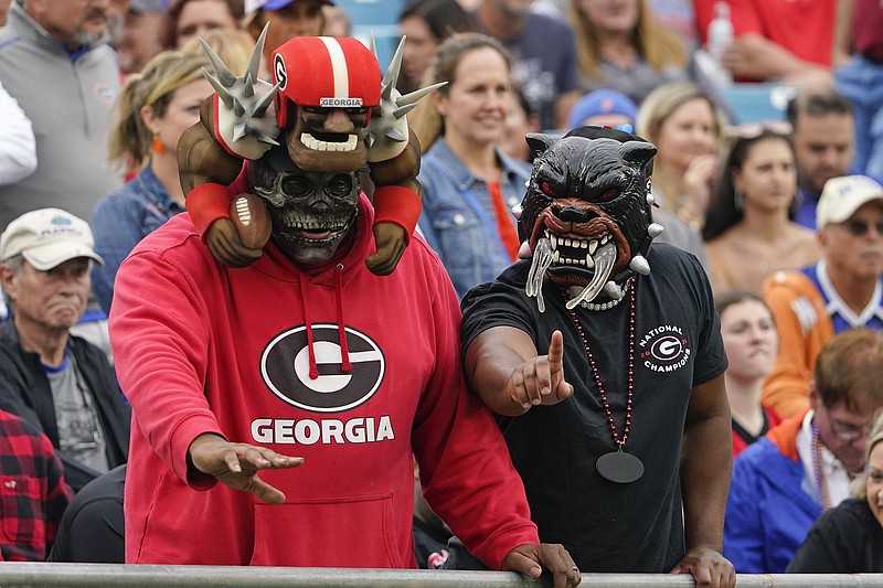 AP photo by John Raoux / Georgia football fans cheer during the Bulldogs' game against Florida last October at TIAA Bank Field in Jacksonville. The matchup of SEC East rivals known as the "World's Largest Outdoor Cocktail Party" will remain at the home of the NFL's Jacksonville Jaguars through at least 2025. Both schools have agreed to exercise a two-year option in their contract with the city of Jacksonville.