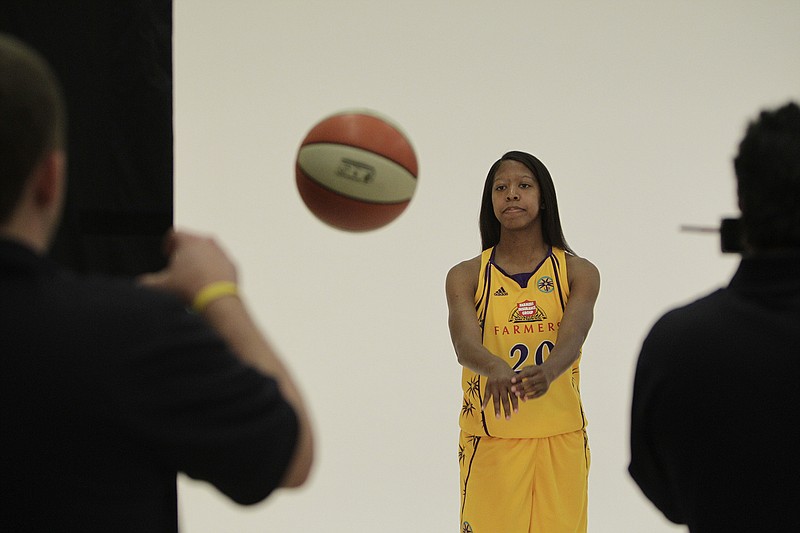 AP photo by Jae C. Hong / Los Angeles Sparks guard Bianca Thomas passes the basketball during the WNBA team's media day in May 2010 in Inglewood, Calif. Bianca Hensley, formerly Thomas, has been hired as girls' basketball coach at Cleveland High School.