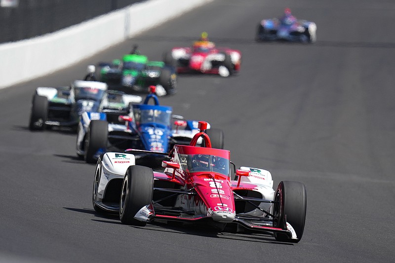 AP photo by Michael Conroy / Marcus Ericsson is followed by Chip Ganassi Racing teammate Alex Palou as they lead a pack of drivers into the first turn at Indianapolis Motor Speedway during Friday's practice for Sunday's Indy 500.