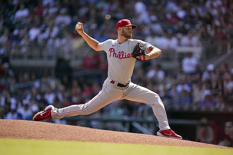 AP photo by Brynn Anderson / Philadelphia Phillies pitcher Zack Wheeler struck out 12 batters in eight innings Saturday to lead his team to a 2-1 road win against the Atlanta Braves.