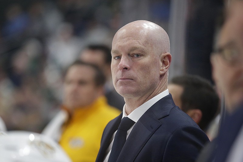 FILE - Nashville Predators head coach John Hynes looks on in the second period during an NHL hockey game against the Minnesota Wild, Sunday, Oct. 24, 2021, in St. Paul, Minn. The Predators fired Hynes on Tuesday, May 30, 2023, moving on from him more than six weeks after missing the playoffs. (AP Photo/Andy Clayton-King, File)