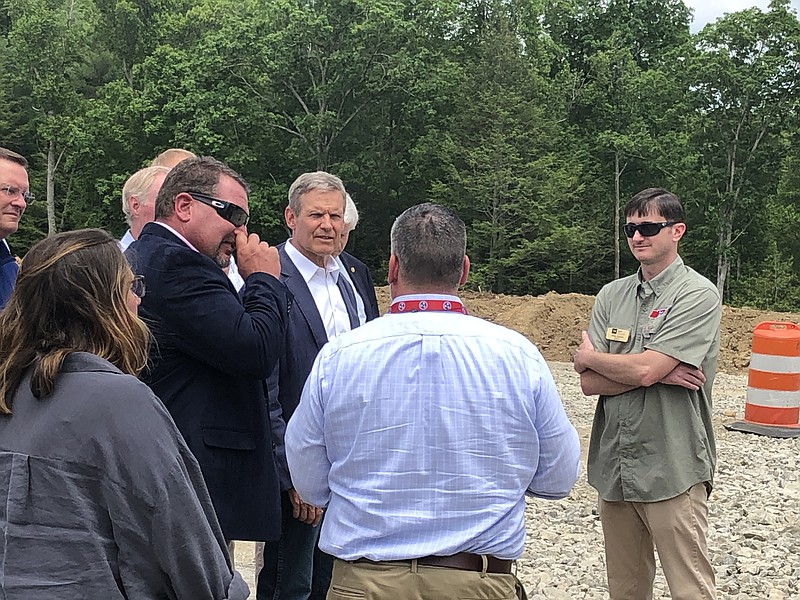 Staff Photo by Andy Sher / Gov. Bill Lee speaks with Tennessee Department of Transportation officials Thursday during a tour of a bridge construction site in Clarkrange, Tenn.