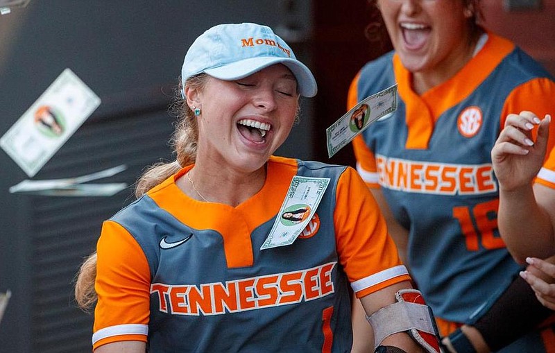 Tennessee Athletics photo / Tennessee's Katie Taylor gets showered with fake money following her two-run home run during the 7-6 topping of Alabama in last month's Southeastern Conference tournament semifinals.