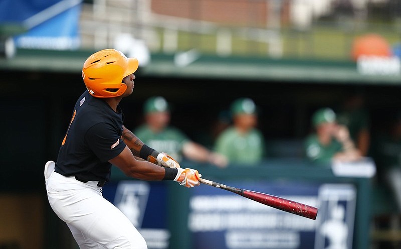 Tennessee Athletics photo / Tennessees Christian Moore watches the flight of his second-inning home run during Sunday night's 9-2 dumping of Charlotte to win the Clemson Regional. Moore homered twice Sunday and had four homers in three games during the NCAA regional.