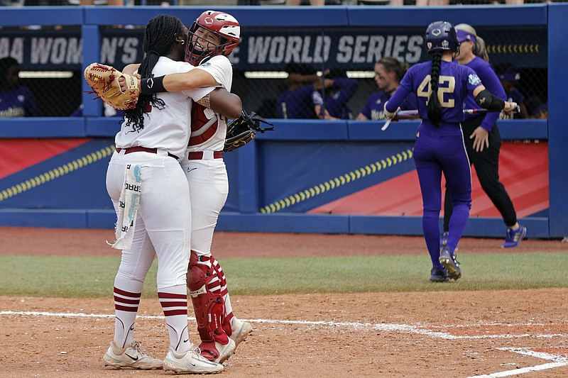 AP photo by Nate Billings / Stanford pitcher NiJaree Canady, left, and catcher Aly Kaneshiro celebrate as Washington's Jadelyn Allchin (42) leaves the field after a Women's College World Series elimination game Sunday in Okahoma City. Canaday pitched a one-hitter in a 1-0 victory for the Cardinal, who will face two-time reigning national champion Oklahoma in the semifinals Monday.