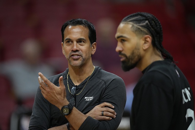 Miami Heat head coach Erik Spoelstra, left, talks with Miami Heat guard Gabe Vincent during a practice ahead of Game 3 of the NBA Finals, at the Kaseya Center in Miami, Tuesday, June 6, 2023. (AP Photo/Rebecca Blackwell)