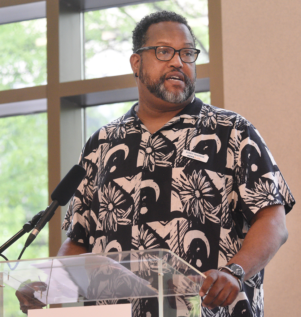 Staff Photo by Matt Hamilton / ArtsBuild President James McKissic speaks during the EPB mural reveal Tuesday.