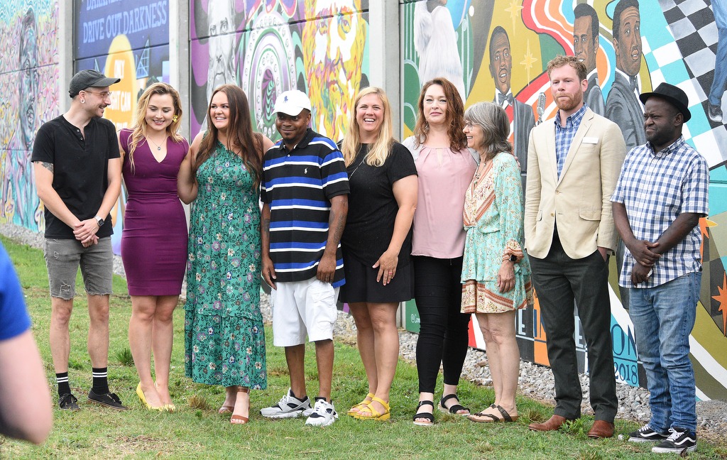 Staff Photo by Matt Hamilton / The mural artists pose for a group photo during the EPB mural reveal Tuesday.