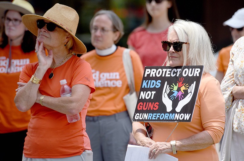 Staff photo by Matt Hamilton / Supporters listen as Dylan Kussman speaks during the Wear Orange event held by the Chattanooga chapter of Moms Demand Action in Miller Park on Sunday, June 4, 2023. The event was held to honor the lives of those lost to gun violence.
