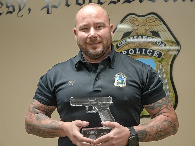 Chattanooga Police Department / On Thursday, Sgt. Josh May of the Police Department's gun team holds the Excellence in Crime Gun Intelligence award that was given to Chattanooga police.