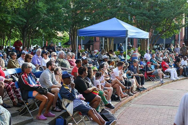 Staff photo by Olivia Ross  / The crowd gathers to listen to KillaKeyz during Nightfall on May 27, 2022, at Miller Plaza. The free concert series continues this Friday at 7 p.m.