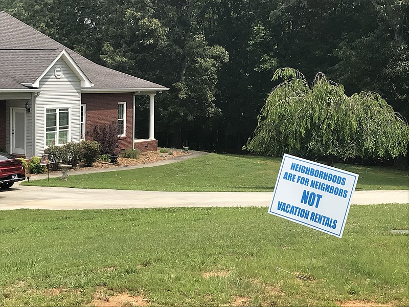 Staff Photo by Emily Crisman / A sign against short-term vacation rentals is seen in the yard of a home in an unincorporated area of Hamilton County.