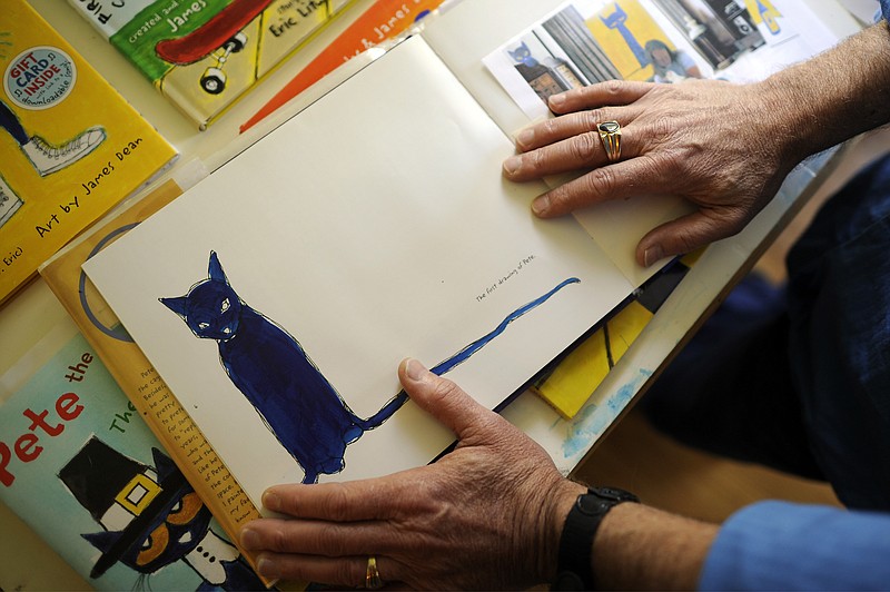 Original author James Dean shows the first portrait of an adopted black kitten that became the subject of the Pete the Cat series of children's books. He and a successor author will be in Cleveland, Tenn., and Fort Payne, Ala., on Aug. 5. /File/AP Photo/Stephen Morton