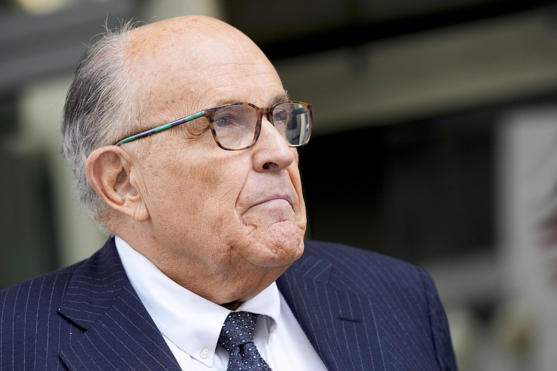 File photo/Patrick Semansky/The Associated Press / Rudy Giuliani speaks with reporters as he departs the federal courthouse on May 19, 2023, in Washington. Giuliani is not disputing that he publicly made statements about two Georgia election workers that were defamatory and false, but he contends they were constitutionally protected statements, according to a statement filed in court.