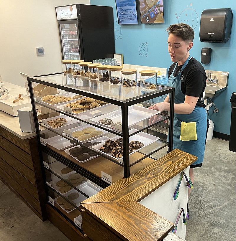 Photography by Dave Flessner / Katie Lepore displays a new batch of baked cookies at the Chattanooga Cookie Co., which was aided in its start last year by a loan from Brightbridge Capital.