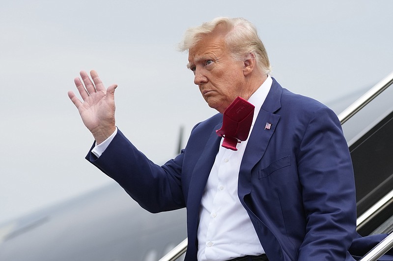 Photo/Alex Brandon/The Associated Press / Former President Donald Trump waves as he steps off his plane at Ronald Reagan Washington National Airport on Thursday, Aug. 3, 2023, in Arlington, Va., as he heads to Washington to face a judge on federal conspiracy charges.