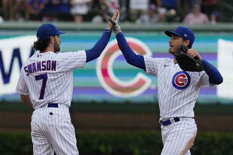AP photo by Nam Y. Huh / Chicago Cubs shortstop Dansby Swanson celebrates with center fielder Cody Bellinger after Sunday's 6-4 home win against the Atlanta Braves.
